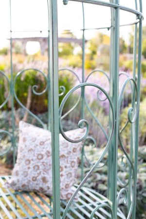 GREEN METAL GARDEN BENCH WITH ARCHED BACK